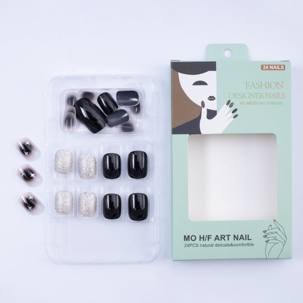 Artificial nails in elegant black with gloss and creative accents Stornfield