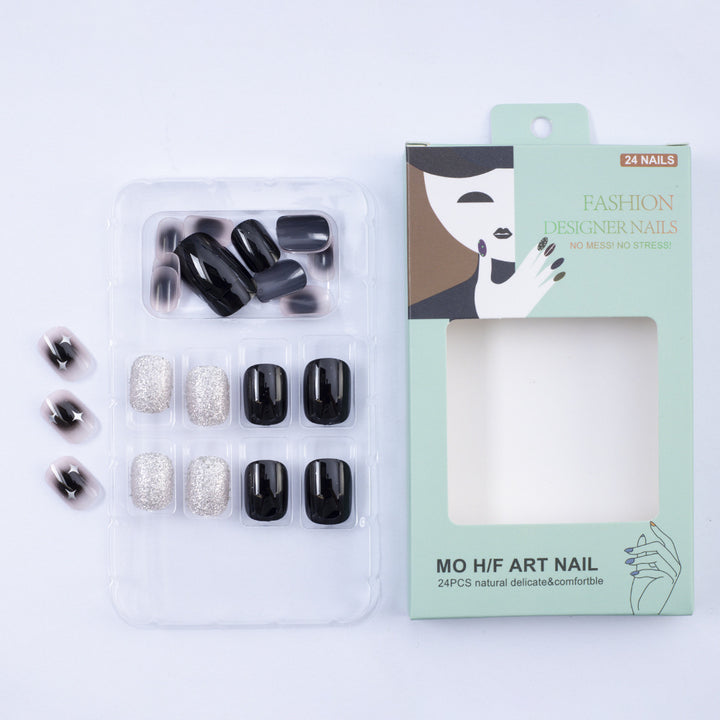 Artificial nails in elegant black with gloss and creative accents Stornfield