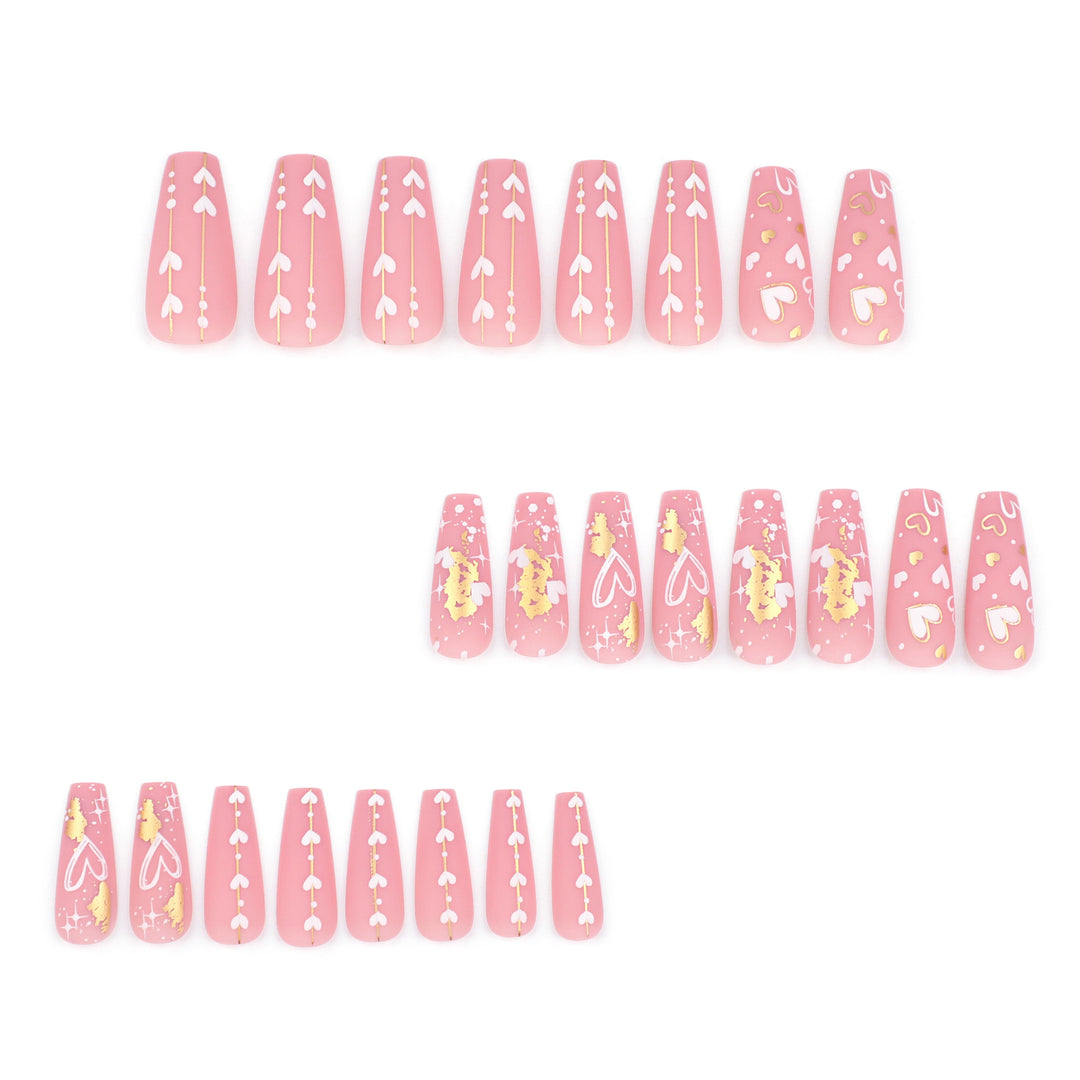 Artificial nail art with heart and glitter designs Stornfield