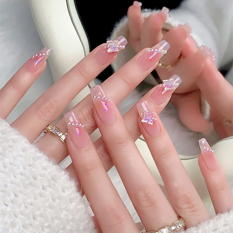 Artificial nails with luxurious pearl and glitter decorations Stornfield