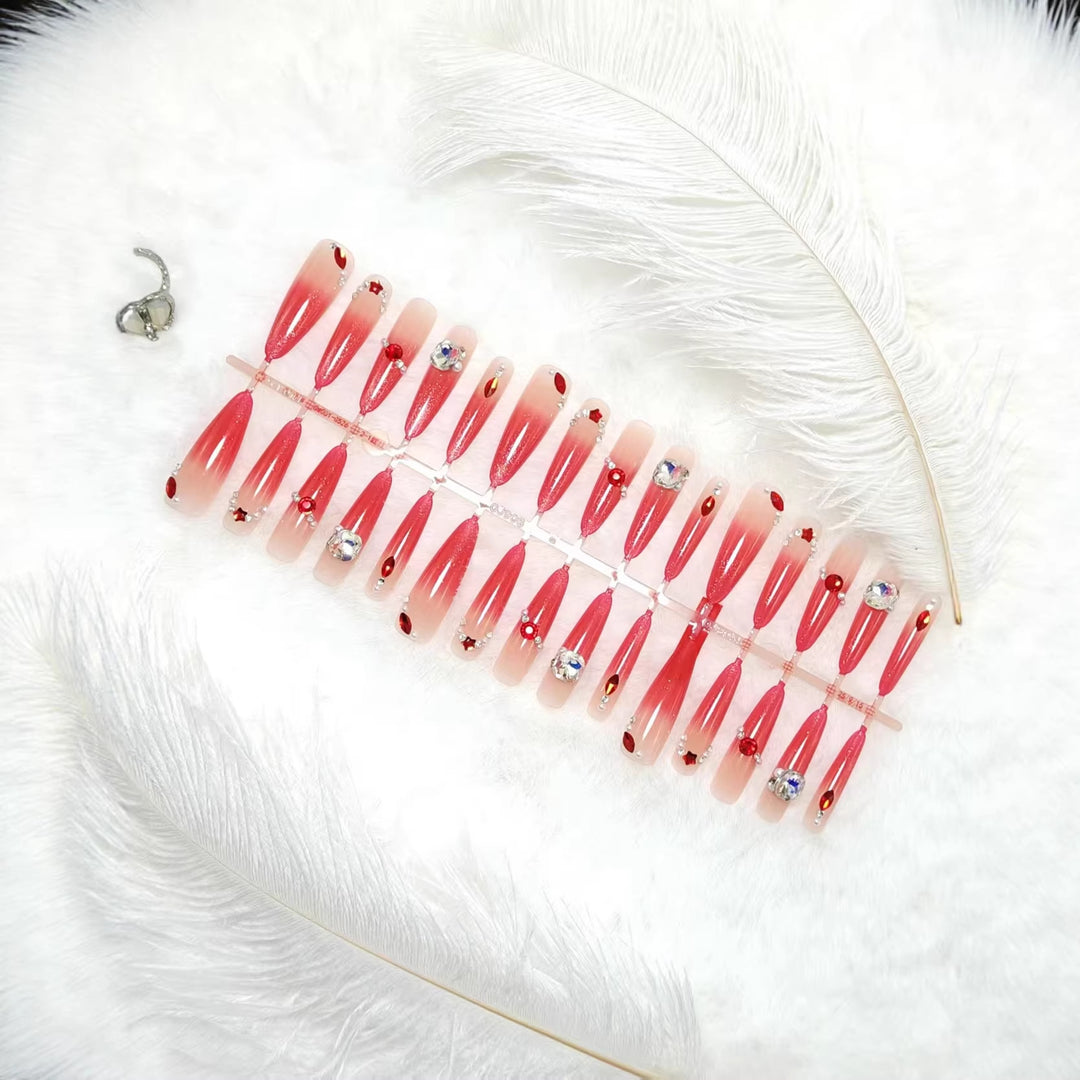 Glamorous artificial nails with sparkling ombre effect and elegant embellishments Stornfield