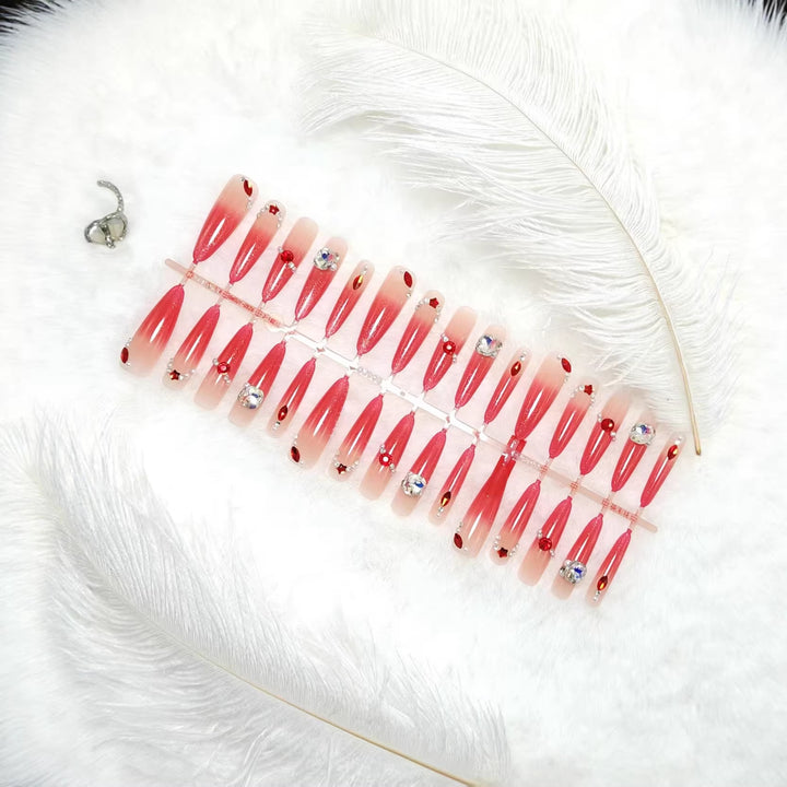 Glamorous artificial nails with sparkling ombre effect and elegant embellishments Stornfield