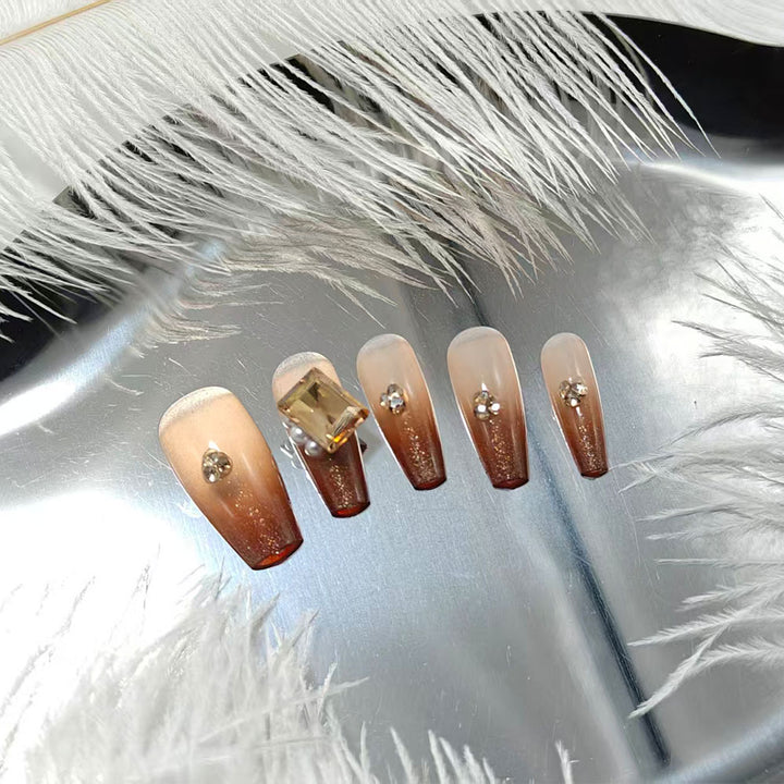 Artificial nails with elegant ombre effect and exquisite gemstones Stornfield