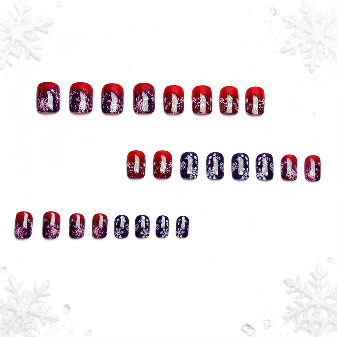 Artificial nails with festive glitter effect and wintry snow motif Stornfield
