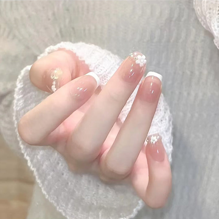 Nail set with elegant flower appliqués and exquisite glitter embellishments Stornfield