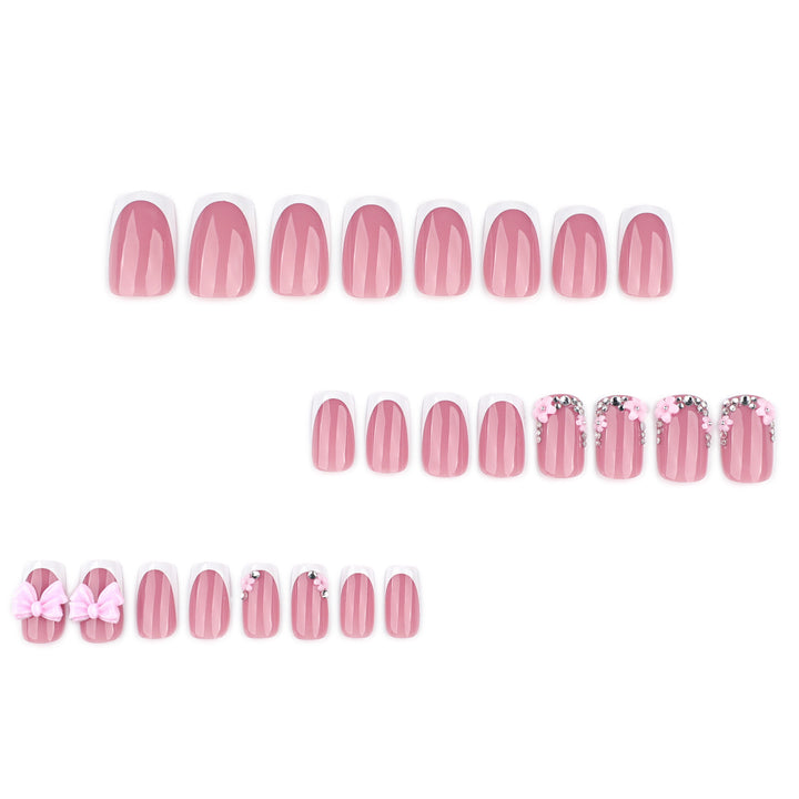 Artful nail extensions with sparkling accents and bow decorations Stornfield