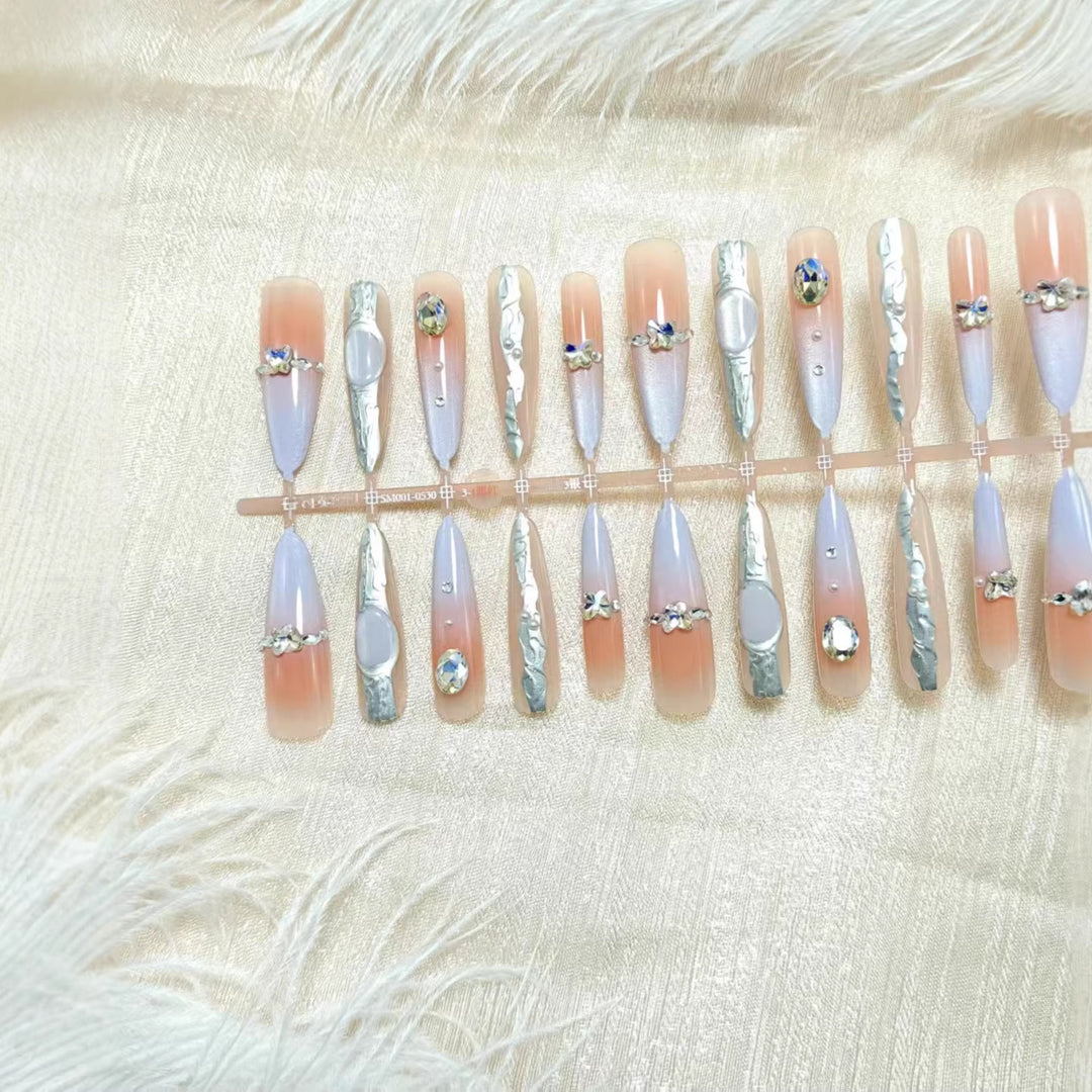 Artificial nails with elegant glitter design and fine 3D decorations Stornfield
