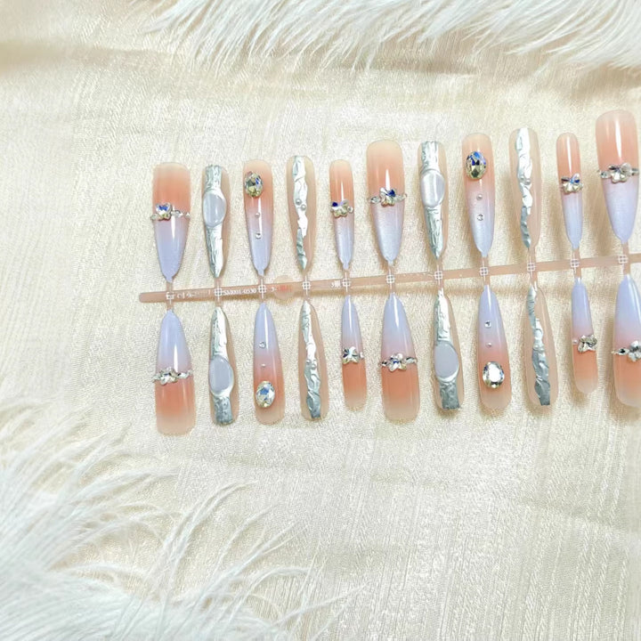 Artificial nails with elegant glitter design and fine 3D decorations Stornfield