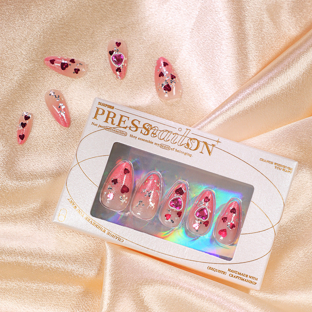 Artful nail art with playful heart designs and glitter Stornfield