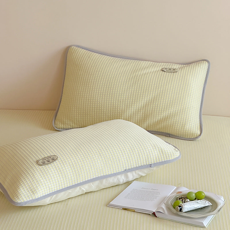 Cooling waffle structure pillow with breathable filling core and decorative piping