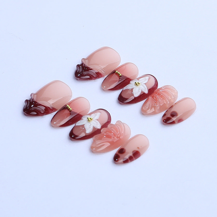 Artificial nail set with floral 3D applications and elegant gradient design Stornfield