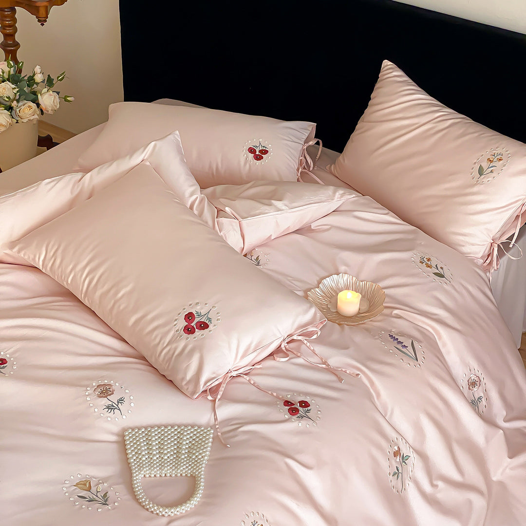 Luxurious cotton satin bedding set with delicate floral embroidery and ties
