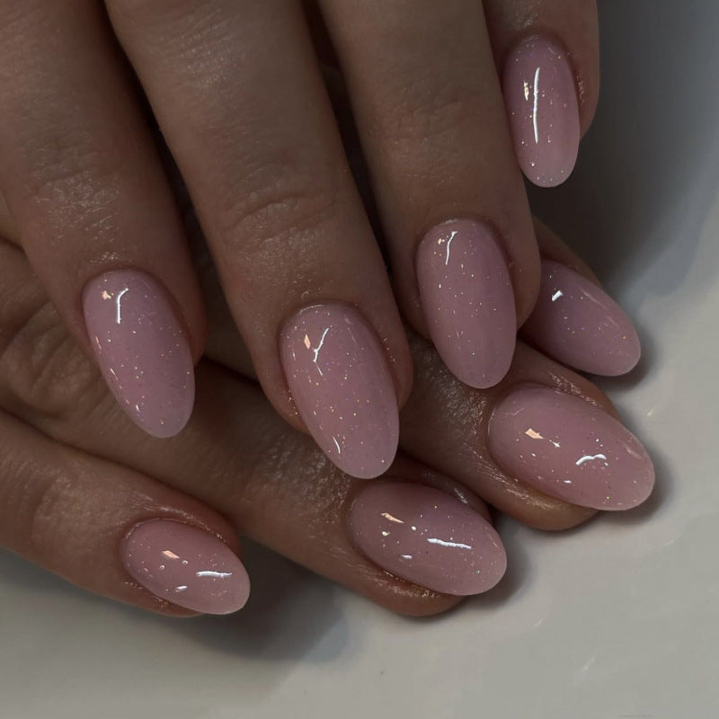 Artificial nail extensions with glitter accents Stornfield
