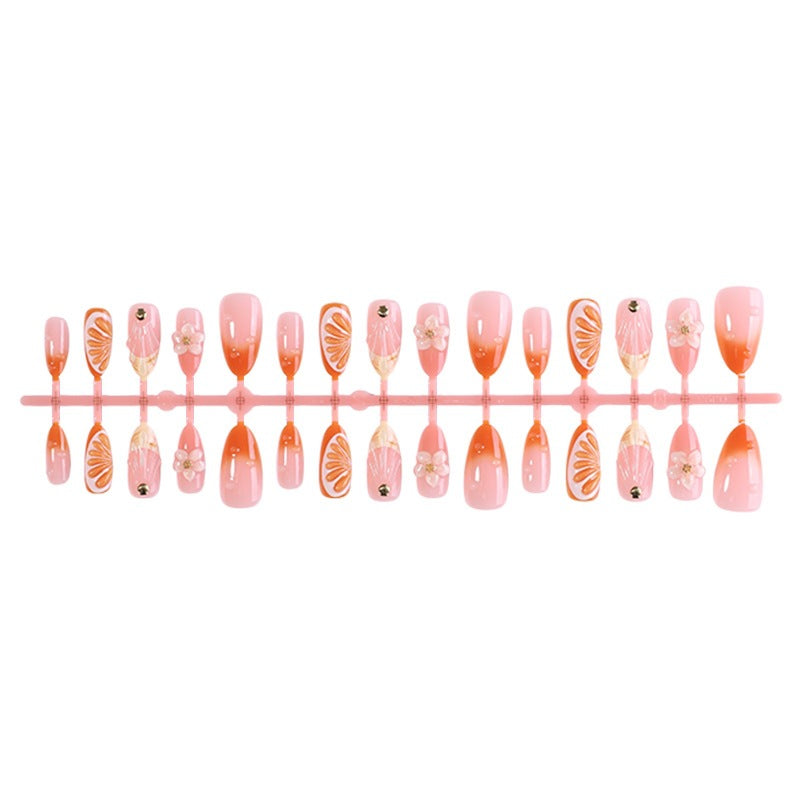Artificial nail set with floral designs and glitter accents Stornfield