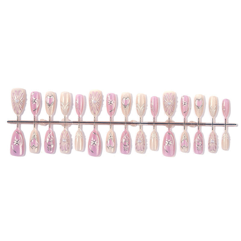 Acrylic nail set with floral accents and glitter embellishments Stornfield