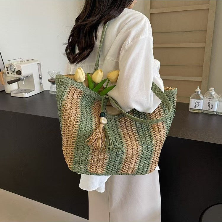 Handcrafted straw bag with elegant tassels and detailed texture Stornfield