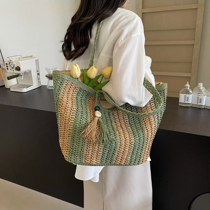 Handcrafted straw bag with elegant tassels and detailed texture Stornfield