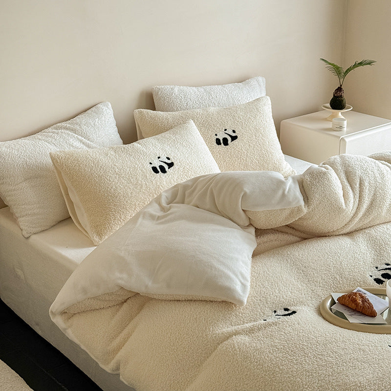 Cozy sherpa bedding set with embroidered penguin motifs and reversible function