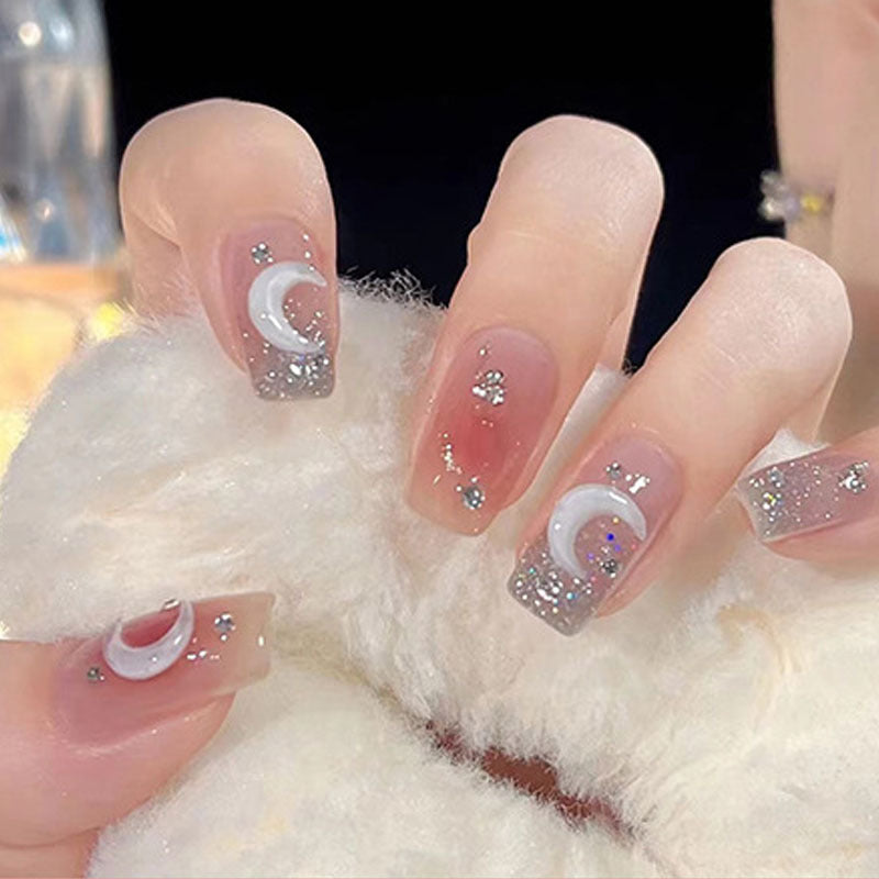 Glamorous artificial nails with delicate flower and glitter effects Stornfield