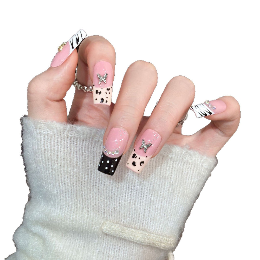 Artistic Press-On Nail Enhancements with Pattern and Gem Accents