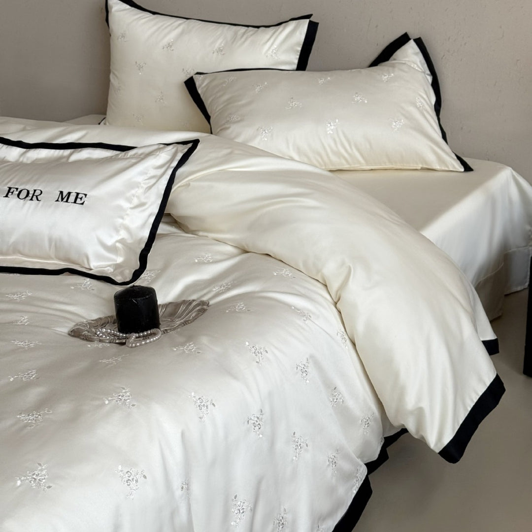 Noble cotton satin bedding set with tone-on-tone floral embroidery and contrasting piping
