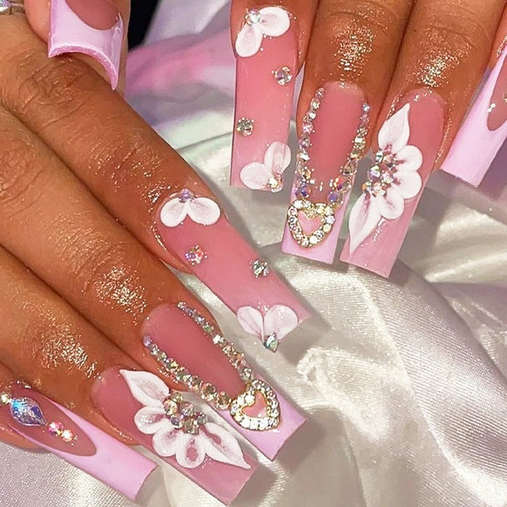 Glamorous artificial nail set with sparkling rhinestones and cross decorations Stornfield