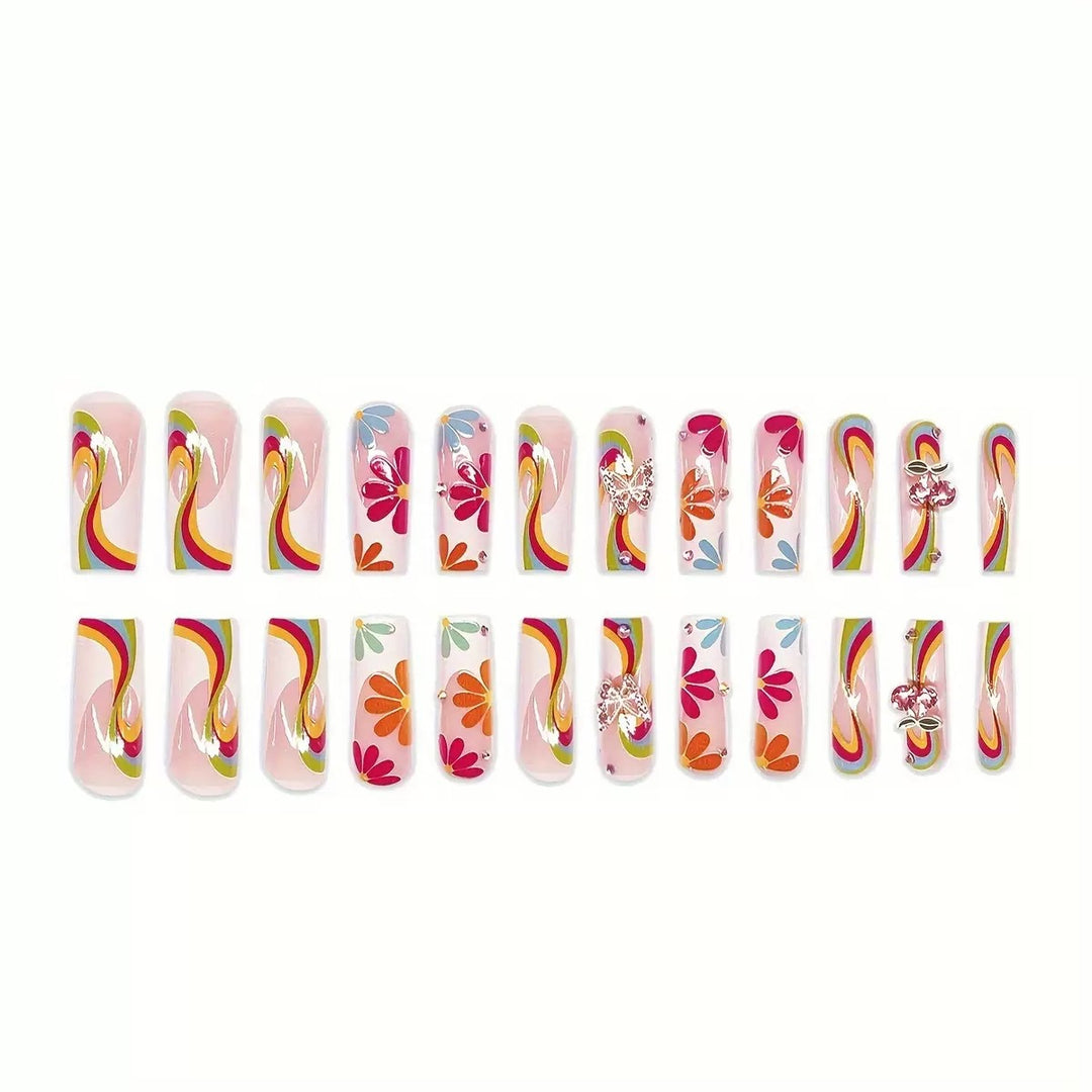 Nail art set with glowing flower motifs and glitter accents Stornfield