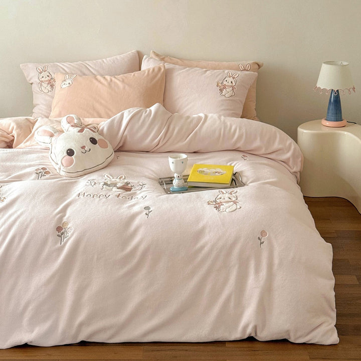 Cute children's bedding set made of soft cotton terry with embroidered cat appliqués and cuddly plush pillow.