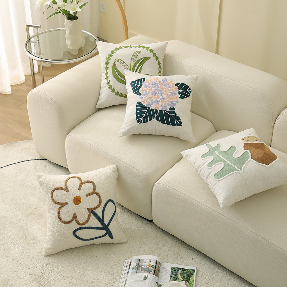 Square bouclé decorative cushion with tufted flower appliqué
