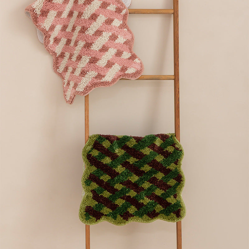 Tufted bathroom runner with wavy hem and relief-style braided pattern Stornfield
