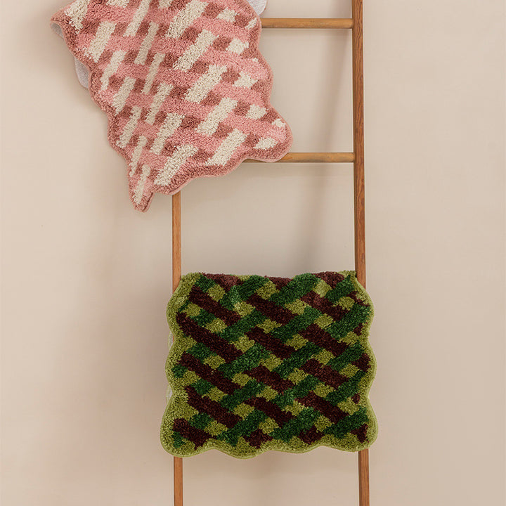 Tufted bathroom runner with wavy hem and relief-style braided pattern Stornfield