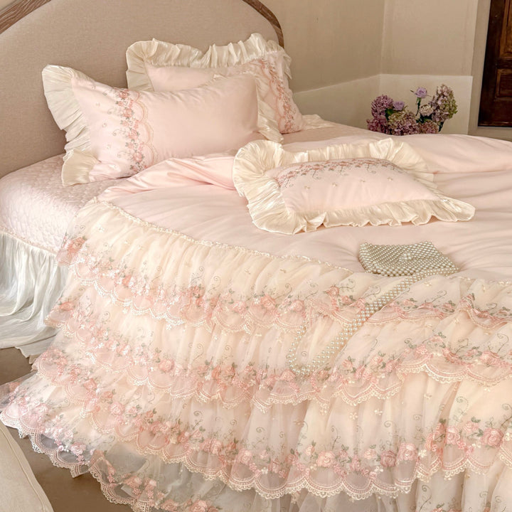 Luxurious Victorian-inspired bedding set with ruffles and embroidery