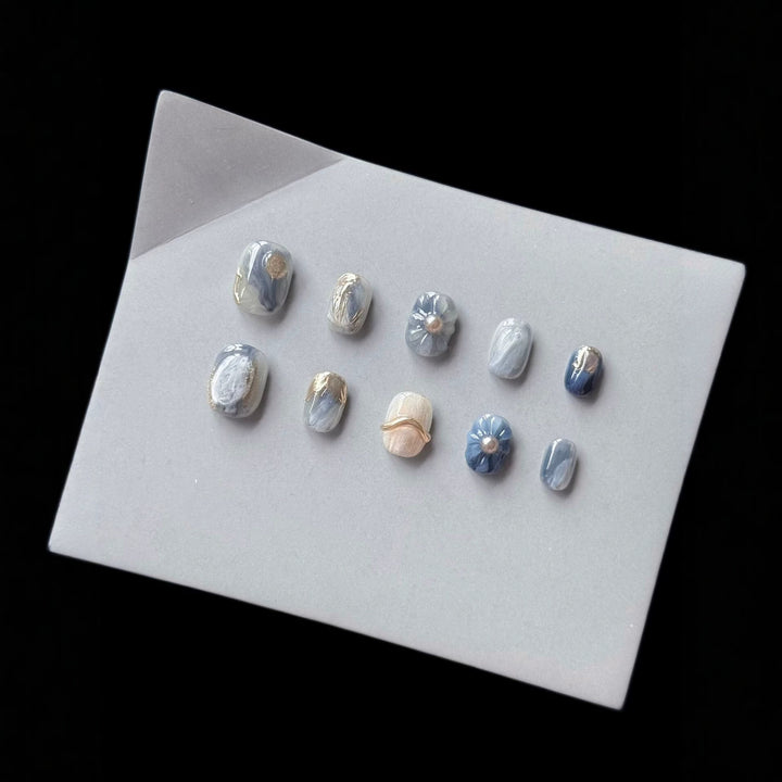 Artistic Press-On Nail Art Set with Unique Floral and Marble Accents