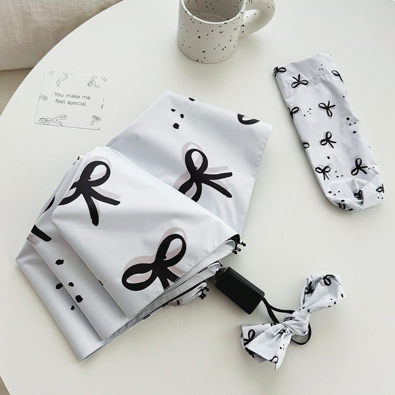 Women’s Folding Umbrella with Playful Bow Pattern Stornfield