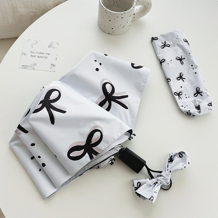 Women’s Folding Umbrella with Playful Bow Pattern Stornfield