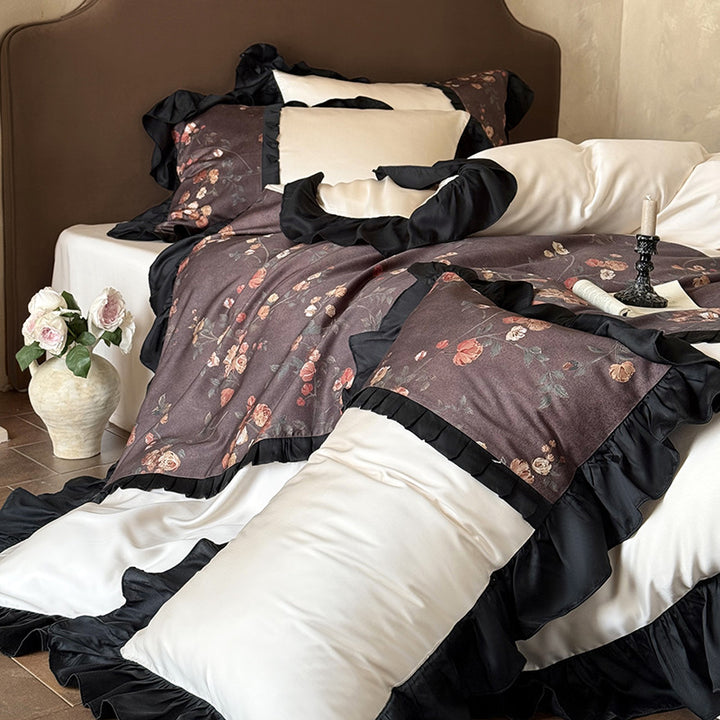 Reversible cotton satin bedding set with floral design and decorative ruffle trim