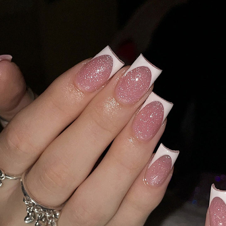 Artful nail decorations with glitter and French tip Stornfield