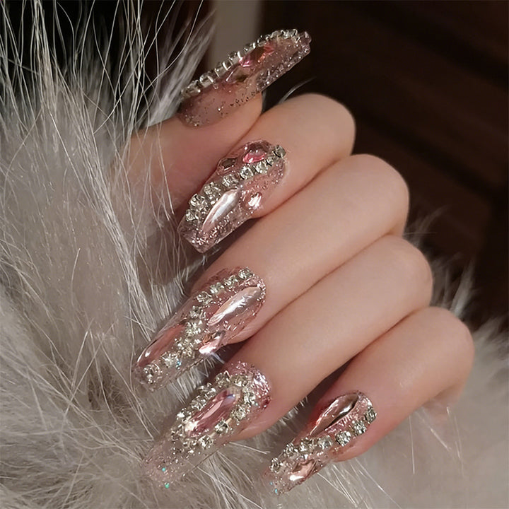 Glamorous artificial nails with sparkling rhinestone decorations Stornfield