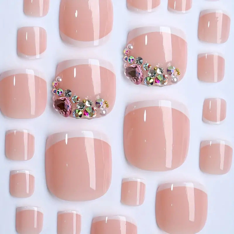 Artificial nail set with elegant French tips and glamorous crystal embellishments Stornfield