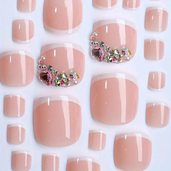 Artificial nail set with elegant French tips and glamorous crystal embellishments Stornfield