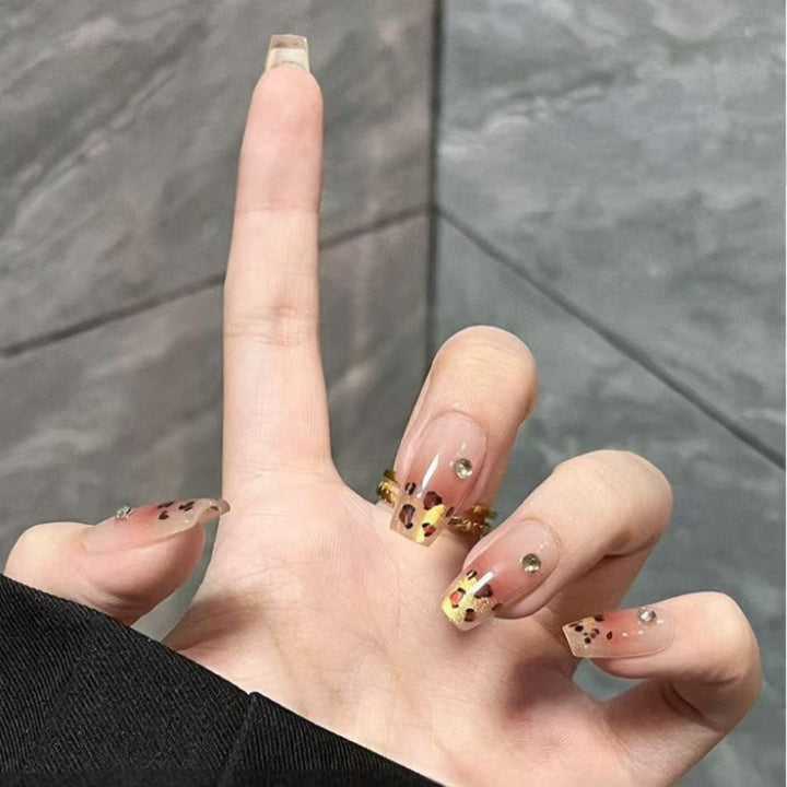 Artificial nails with elegant leopard pattern and glitter accents Stornfield