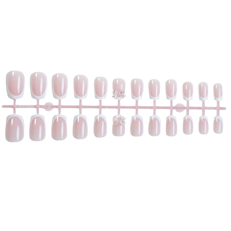 Elegant artificial nails with delicate glitter and decorative accents Stornfield