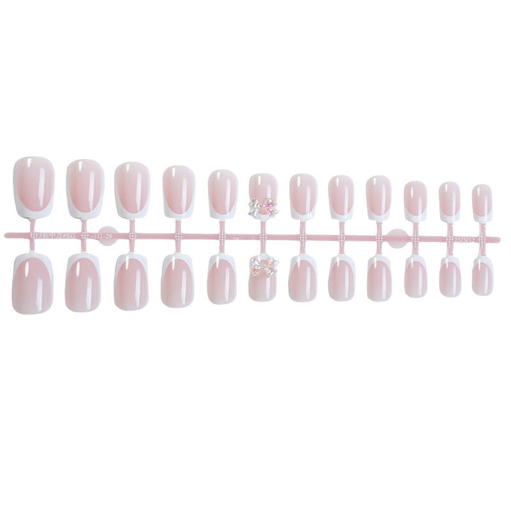 Elegant artificial nails with delicate glitter and decorative accents Stornfield