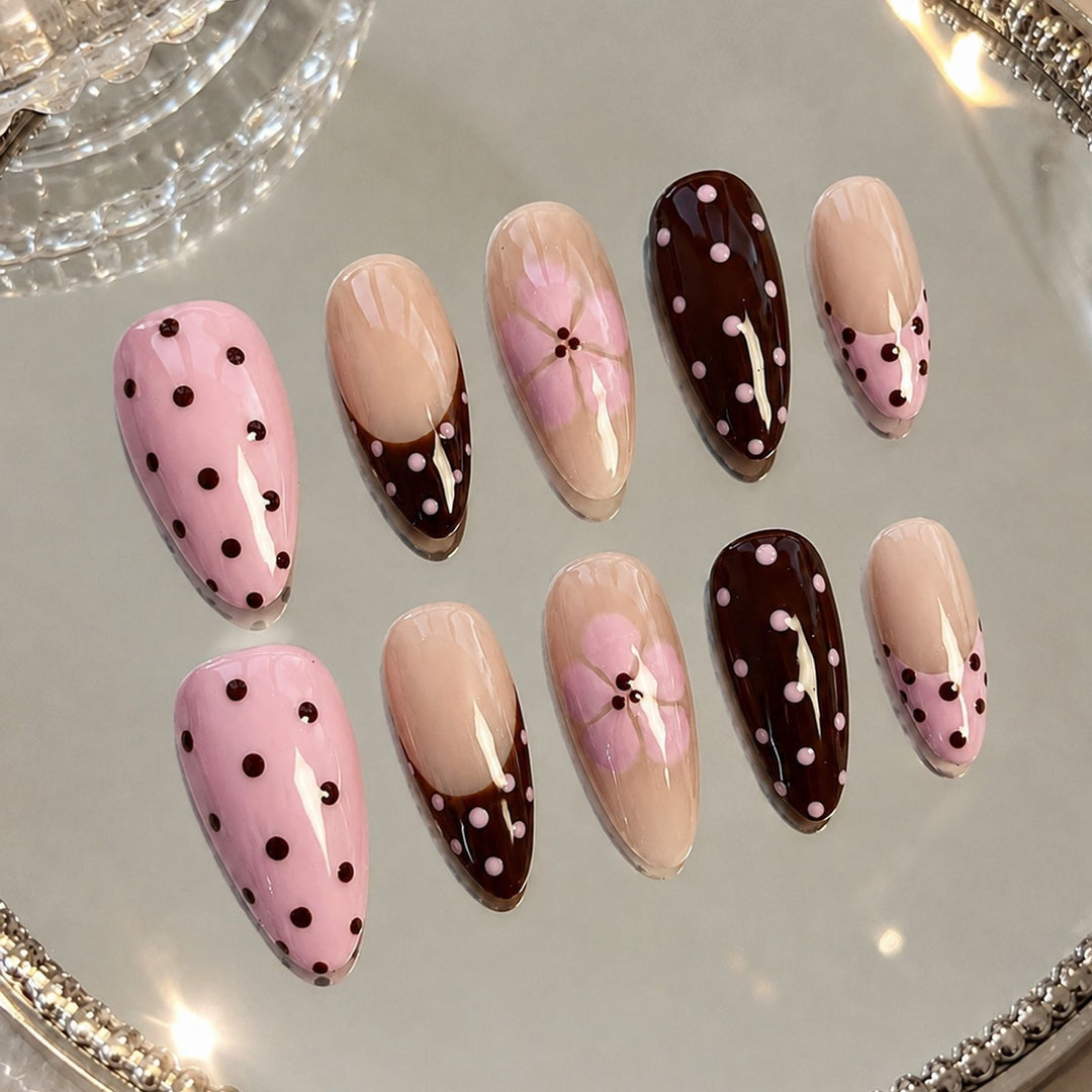 Artificial nail set with playful dots and floral accents Stornfield
