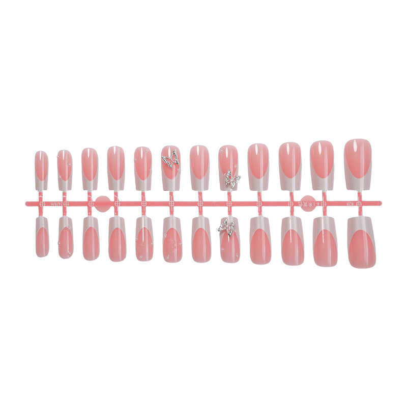 Nail art set with intricate designs and butterfly appliqués Stornfield
