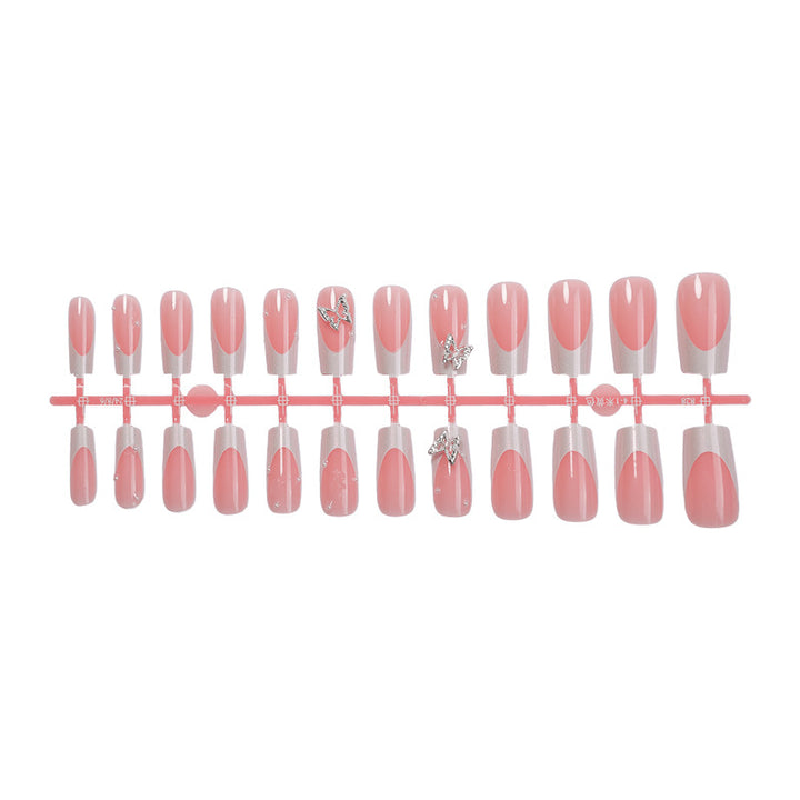 Nail art set with intricate designs and butterfly appliqués Stornfield