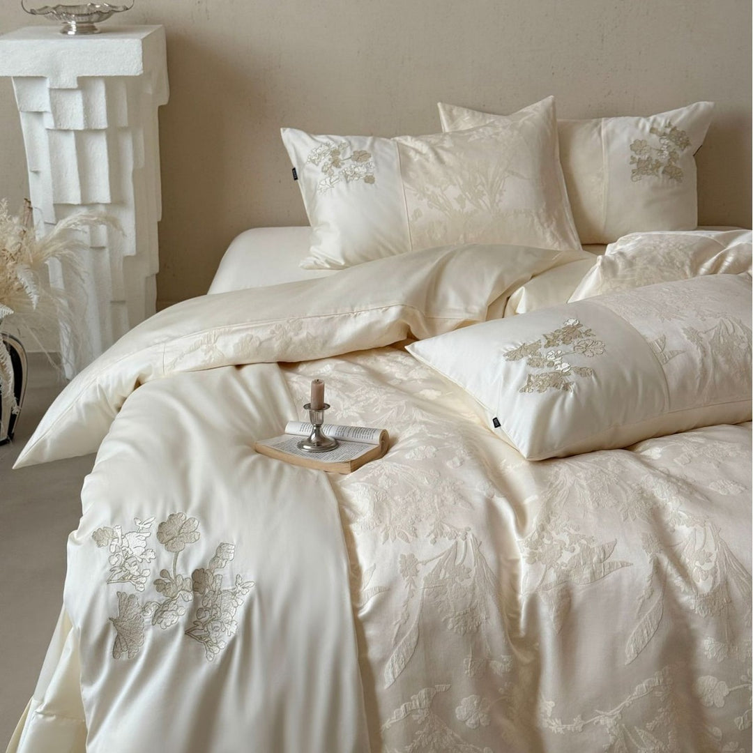 Silky satin bedding set with jacquard relief, floral embroidery, and ruffle