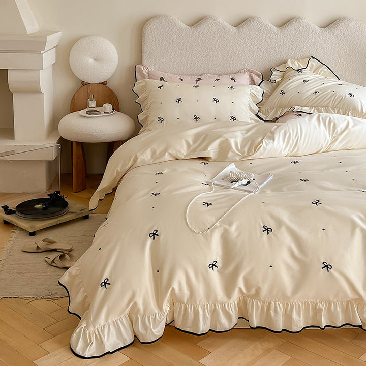 Exclusive bedding set in romantic style with ruffle, subtle bow embroidery, and breathable cotton satin