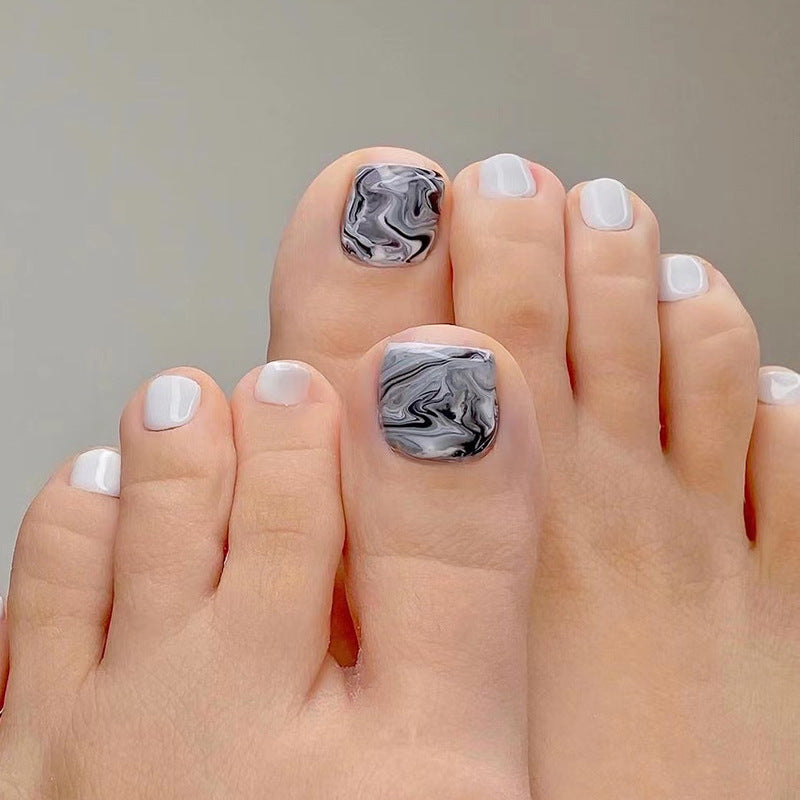 Artful toenail art in elegant marble design Stornfield