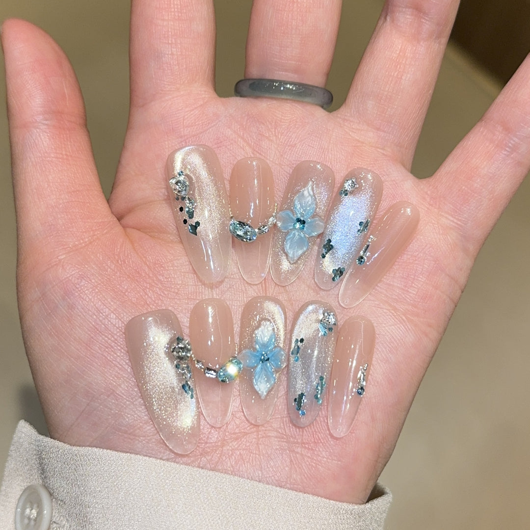 Artificial nails with unique floral design and glitter accents Stornfield
